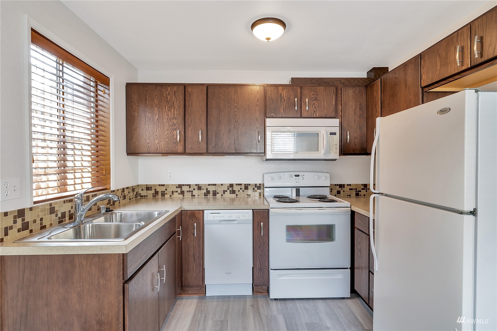 2619 Rucker Avenue, Unit 1 Everett, WA 98201 - Photo 4 of 19 a kitchen with a refrigerator sink and stove
