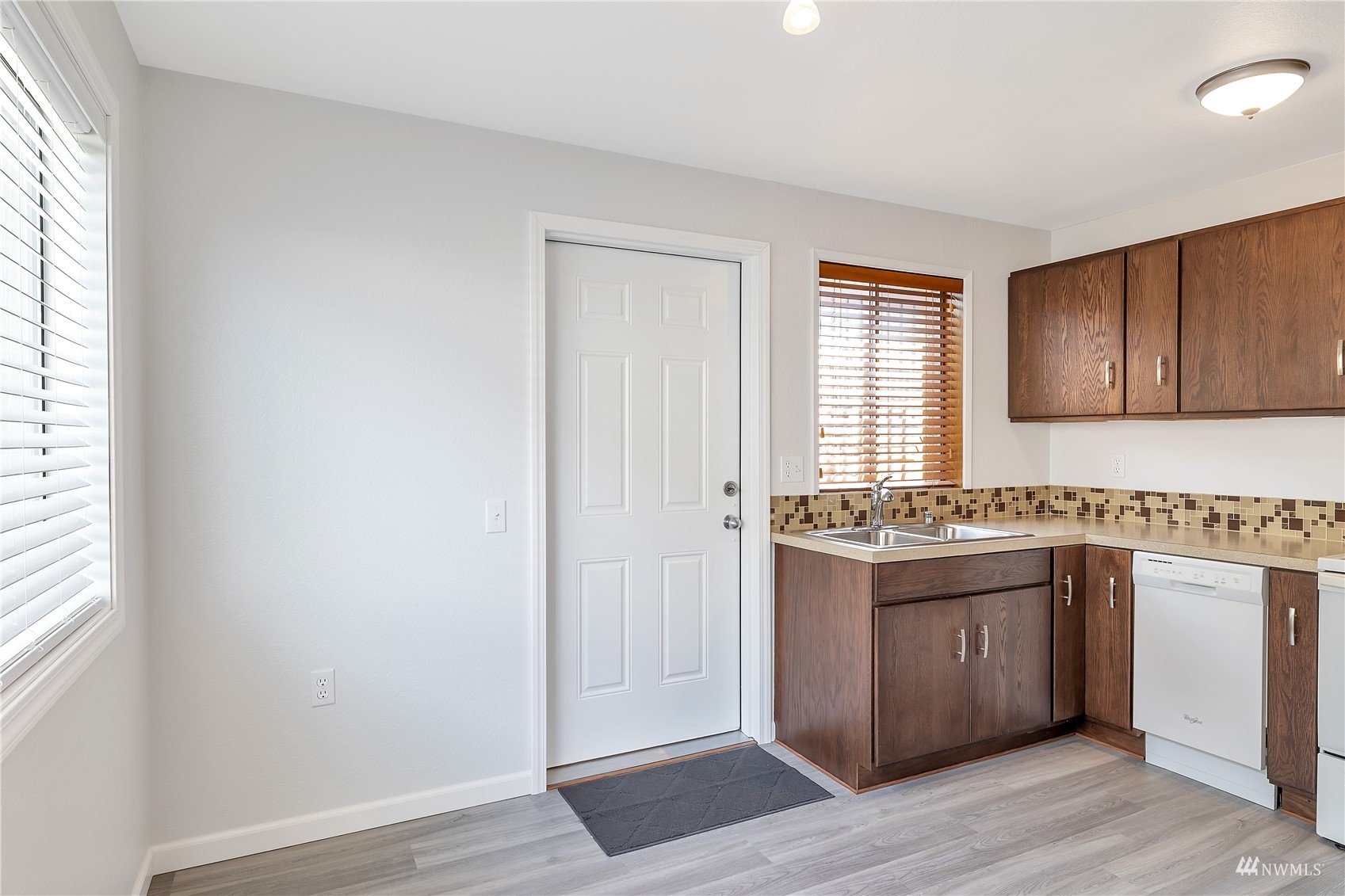 2619 Rucker Avenue, Unit 1 Everett, WA 98201 - Photo 6 of 19 an empty room with wooden floor and windows