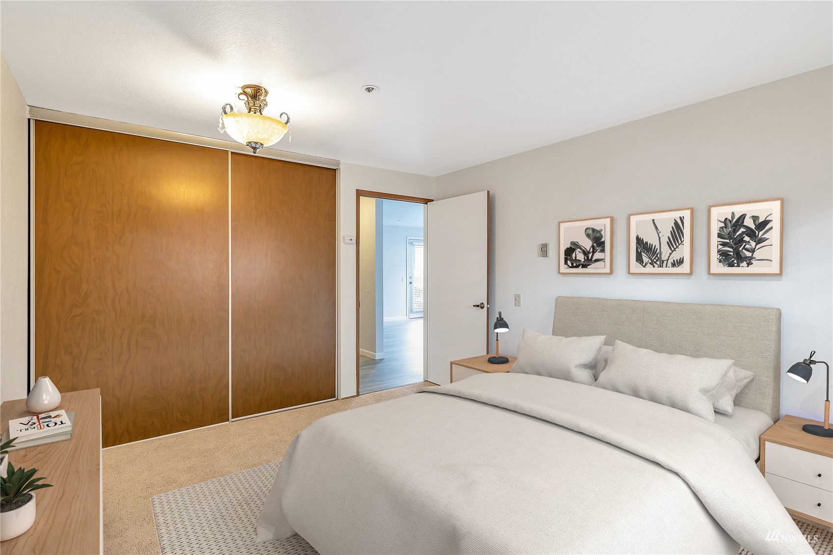 2619 Rucker Avenue, Unit 1 Everett, WA 98201 - Photo 8 of 19 a bedroom with a bed and a chandelier