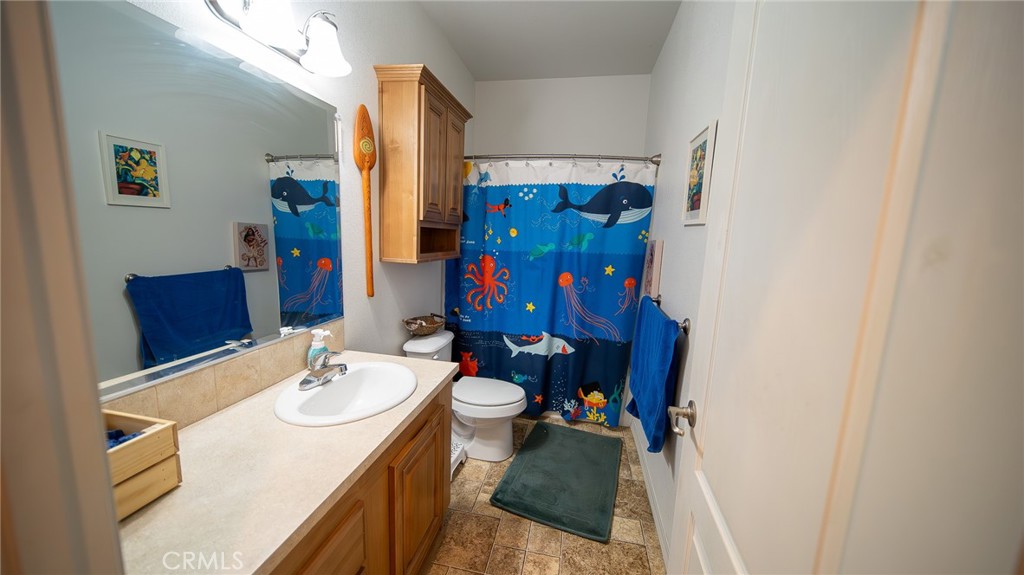 5 Ash Via Anaheim, CA 92801 - Photo 6 of 17 a bathroom with a sink vanity mirror and toilet