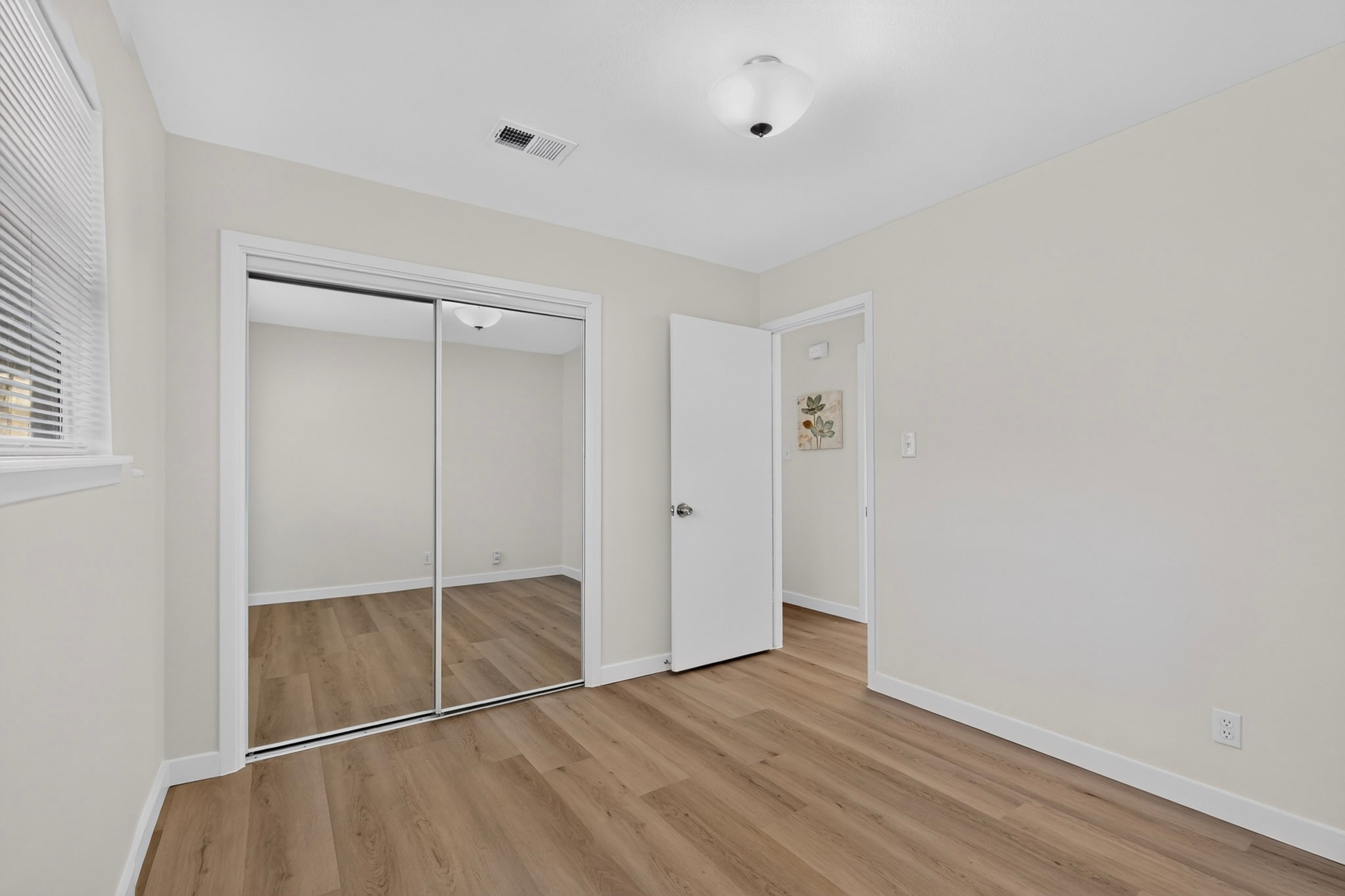 6507 Middleham Place Austin, TX 78745 - Photo 16 of 20 one of two secondary bedrooms with new closet doors