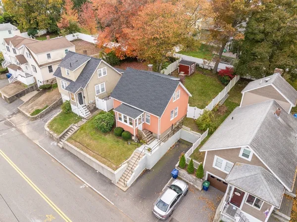 an aerial view of residential house with outdoor space and parking