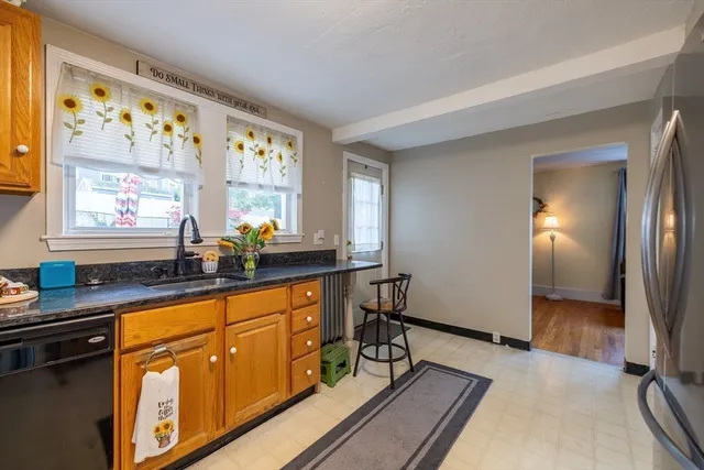 a kitchen with wooden cabinets and sink