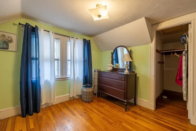 a bed room with a bed and a mirror