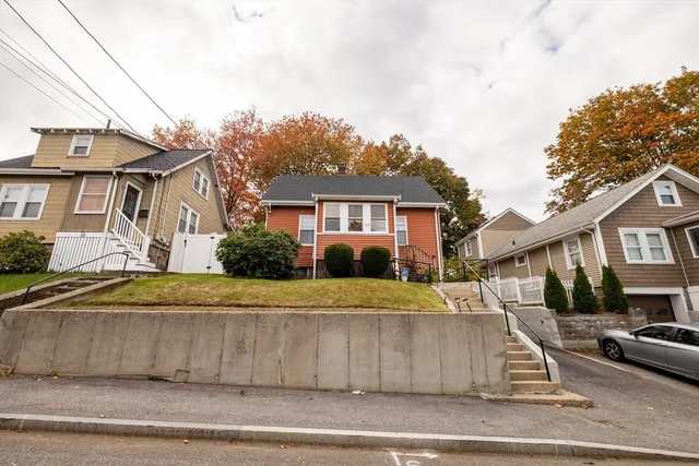 a front view of a house with a yard