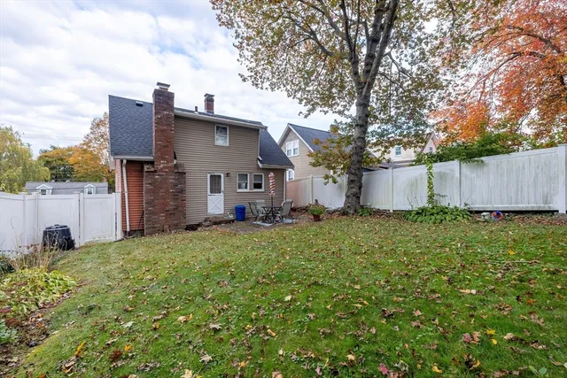 a view of a house with a back yard