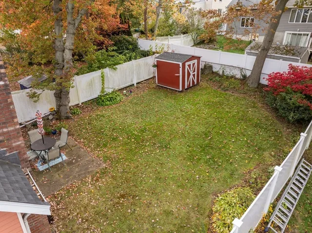 a view of a chairs in backyard of the house