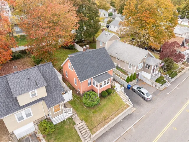 an aerial view of a house with outdoor space