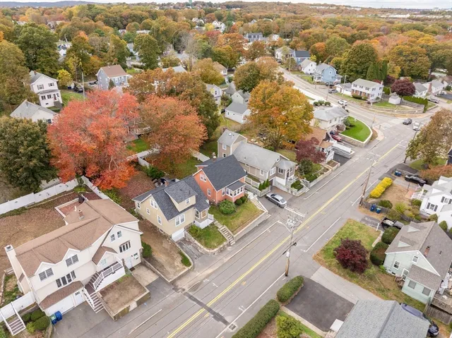 an aerial view of residential houses with outdoor space