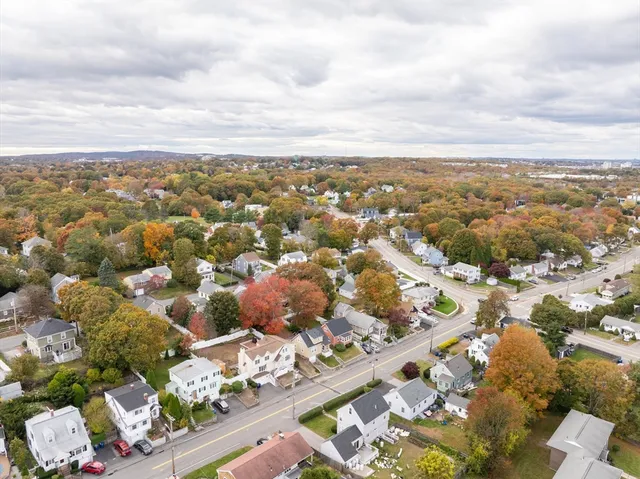 an aerial view of residential houses with outdoor space