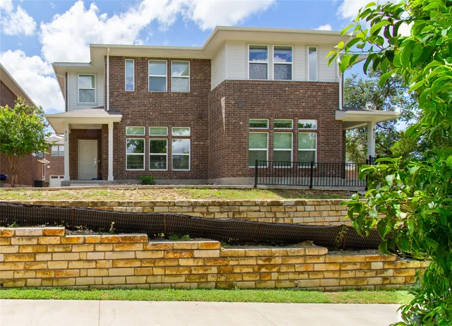 a view of house with a swimming pool