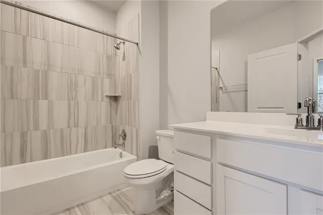 a view of washer and dryer with kitchen in the background
