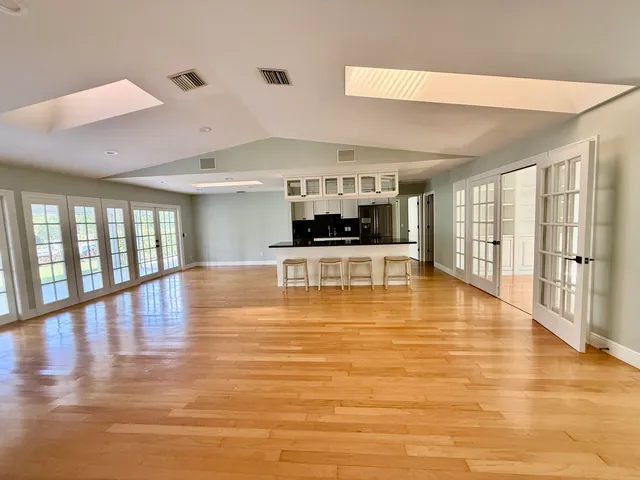 a view of a kitchen with a large window