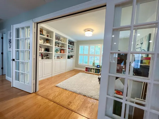 wooden floor with windows and utility room