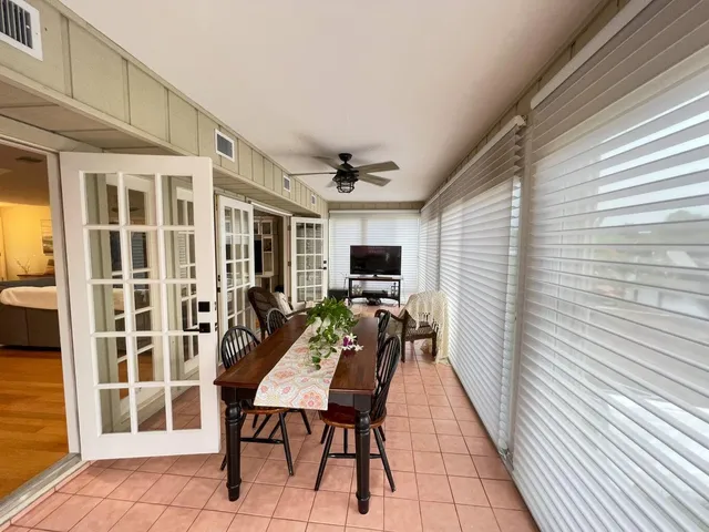a outdoor space with a large window and furniture