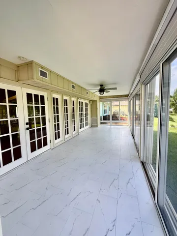 a view of empty room with windows