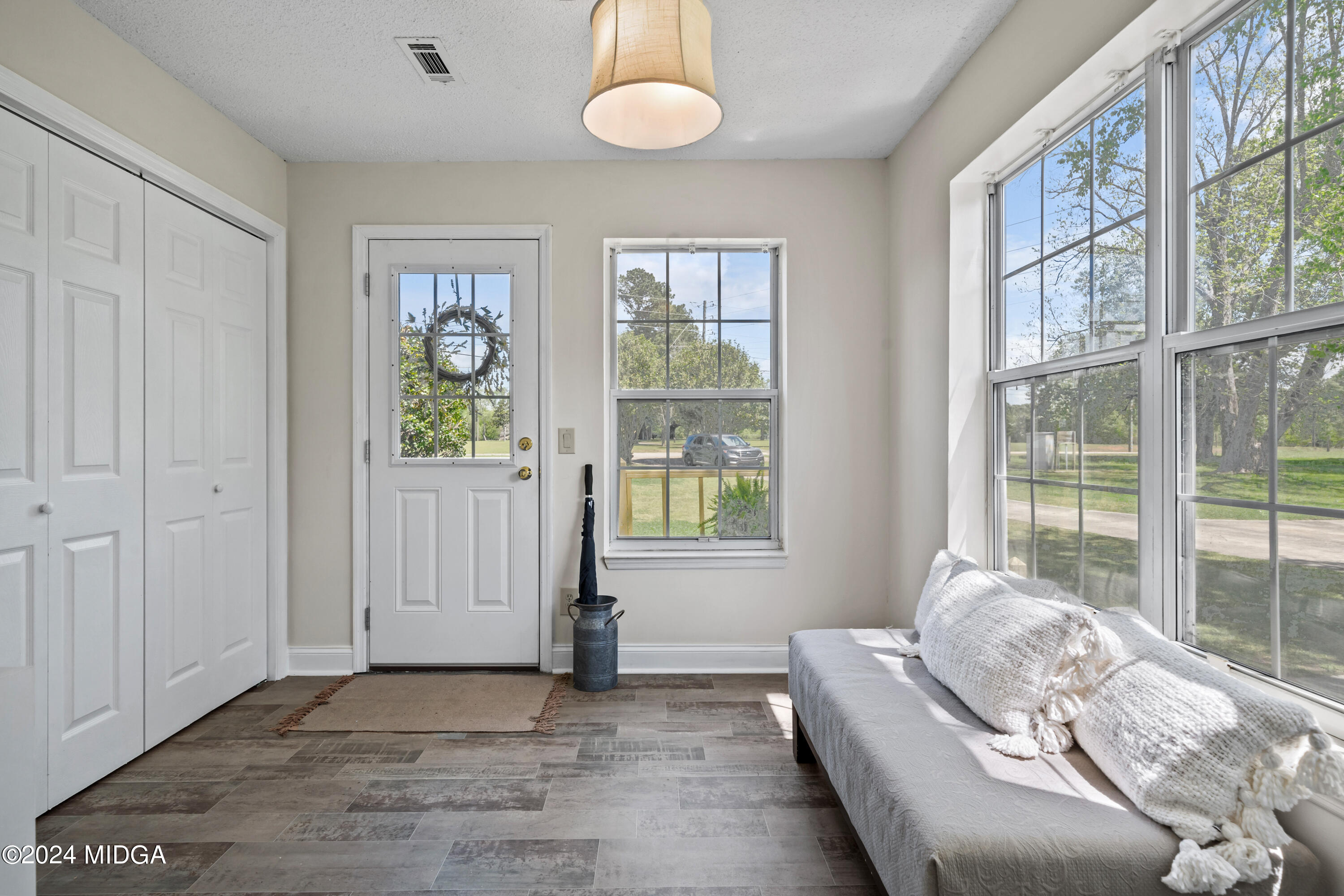 246 Langston Road Perry, GA 31069 - Photo 19 of 37 a living room with furniture and a window