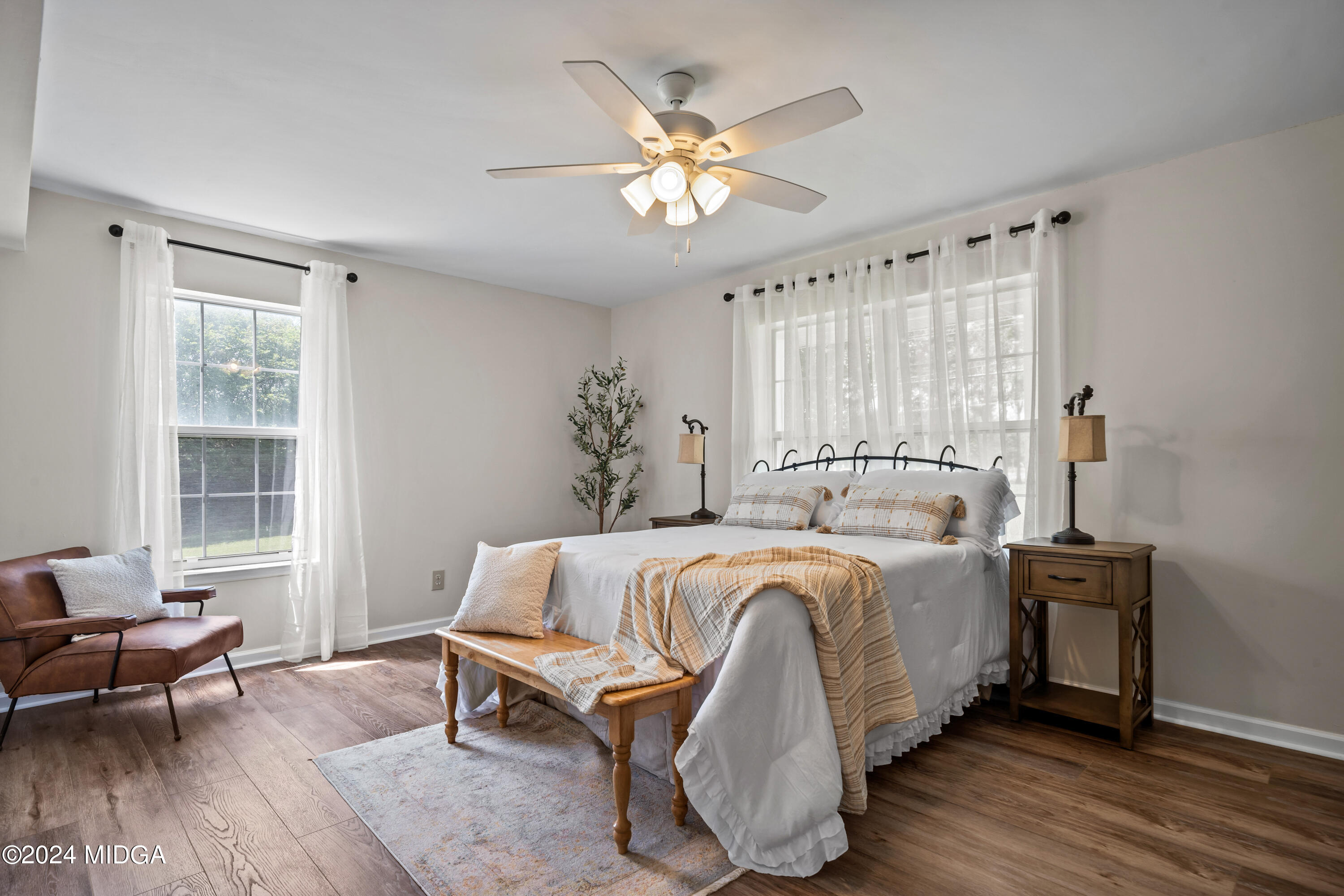 246 Langston Road Perry, GA 31069 - Photo 23 of 37 a bed room with a bed and a chair