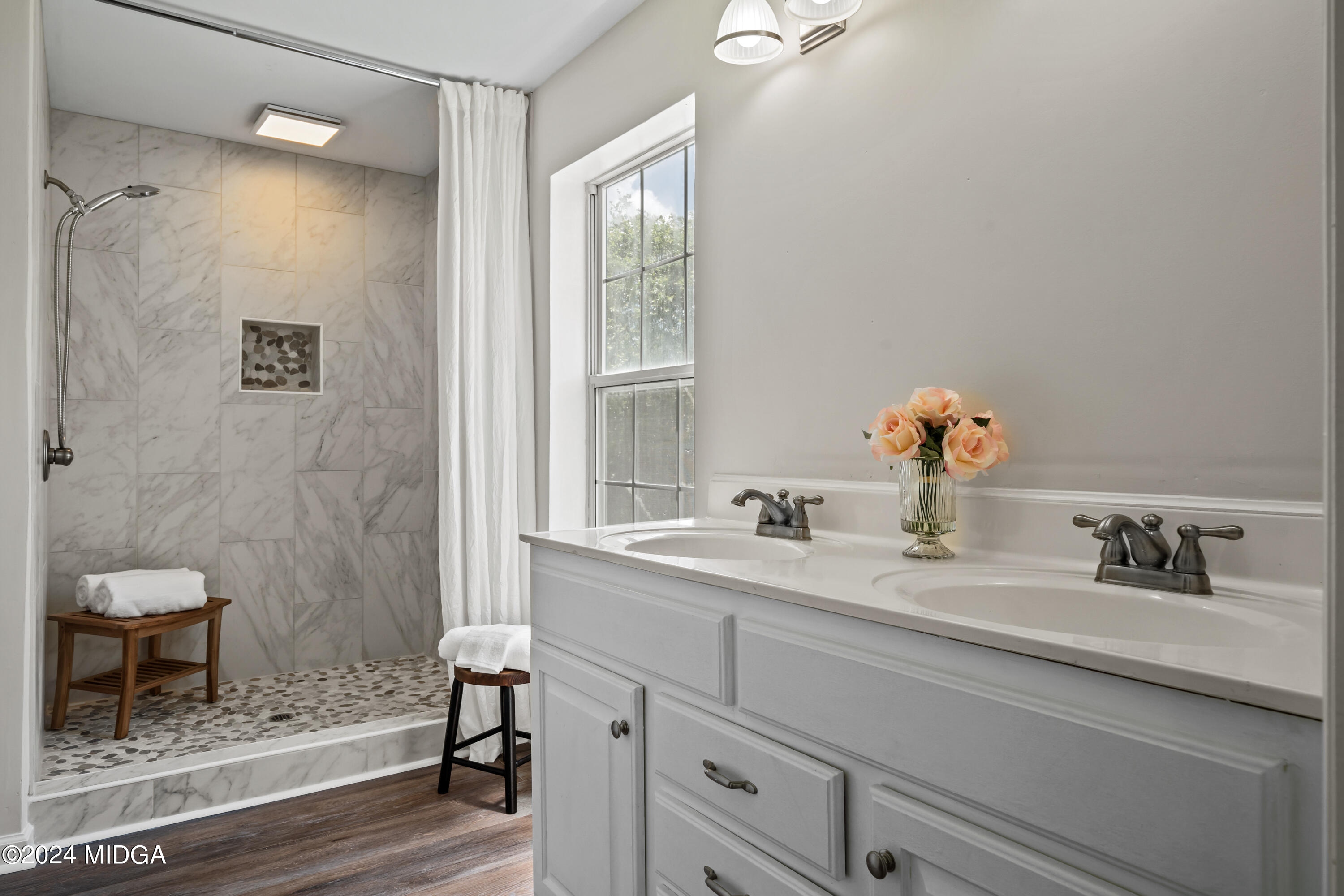 246 Langston Road Perry, GA 31069 - Photo 25 of 37 a bathroom with a sink a toilet and a mirror
