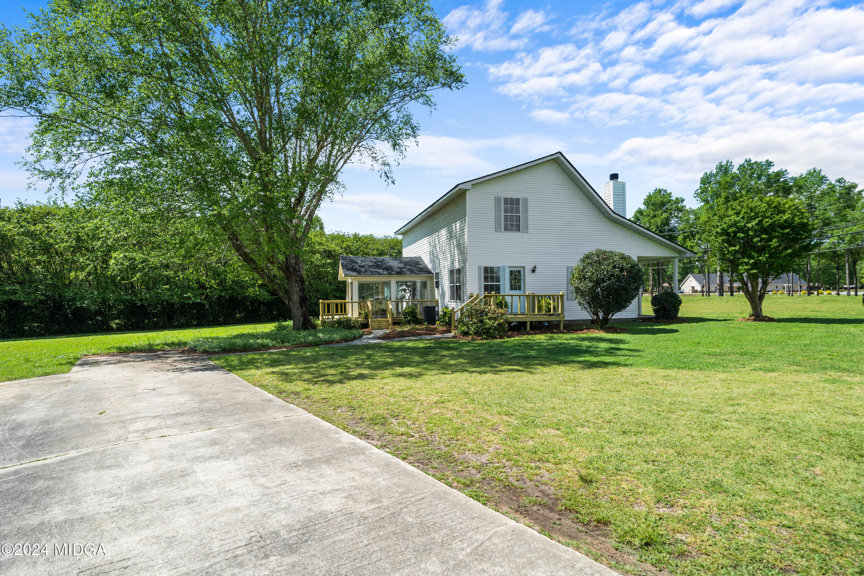 246 Langston Road Perry, GA 31069 - Photo 3 of 37 a house view with a garden space