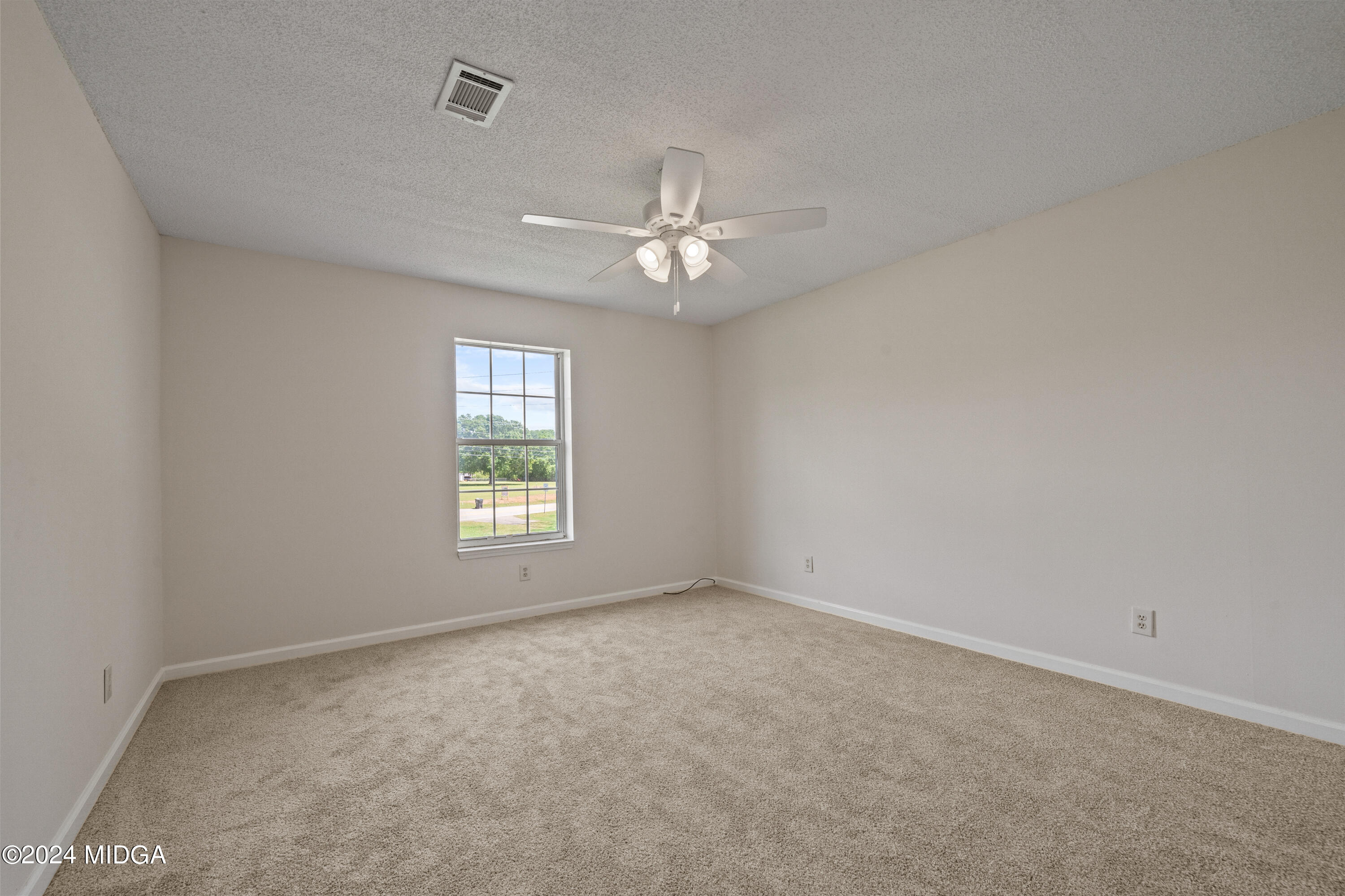 246 Langston Road Perry, GA 31069 - Photo 34 of 37 wooden floor in an empty room with a window