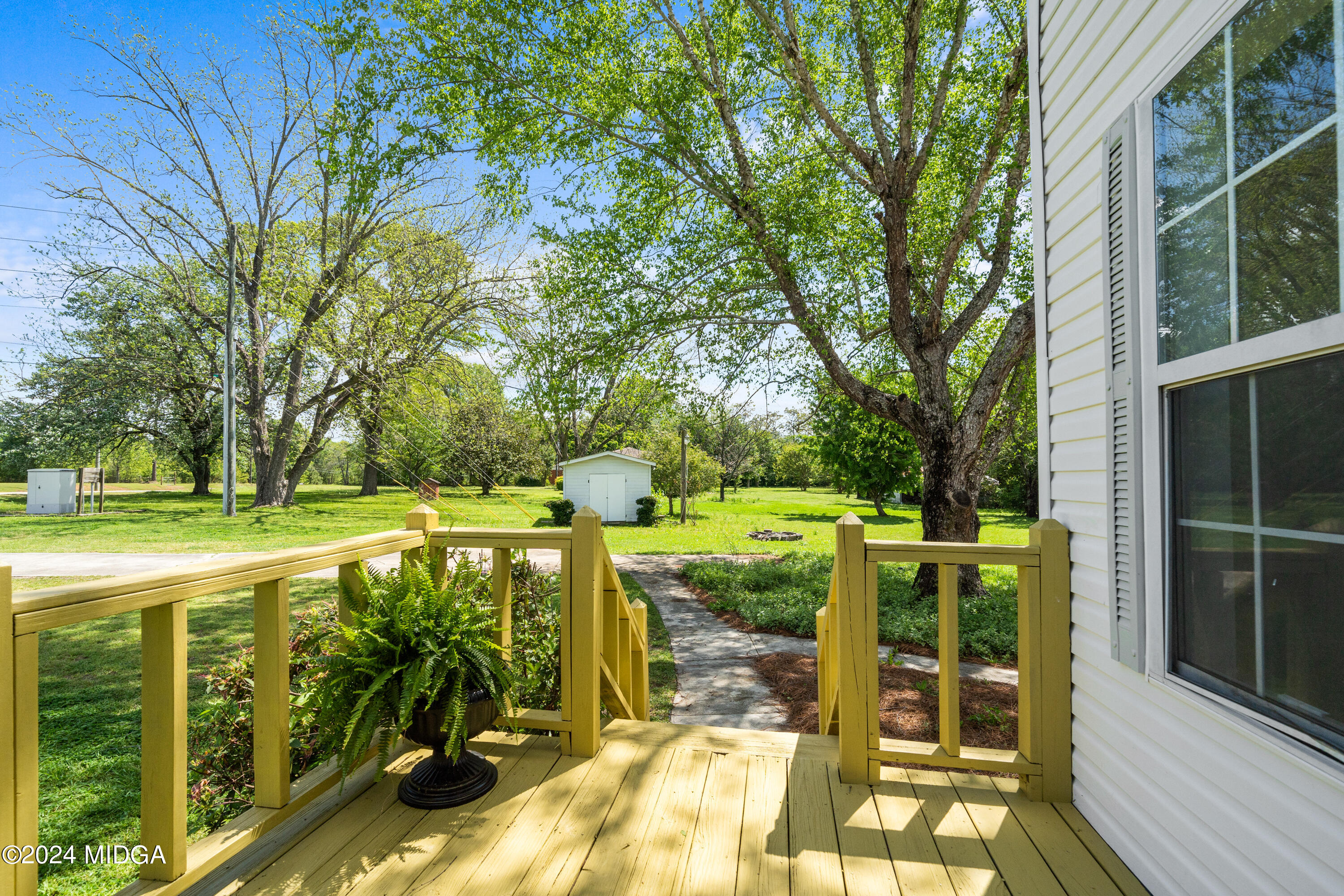 246 Langston Road Perry, GA 31069 - Photo 7 of 37 a view of a swimming pool with a patio
