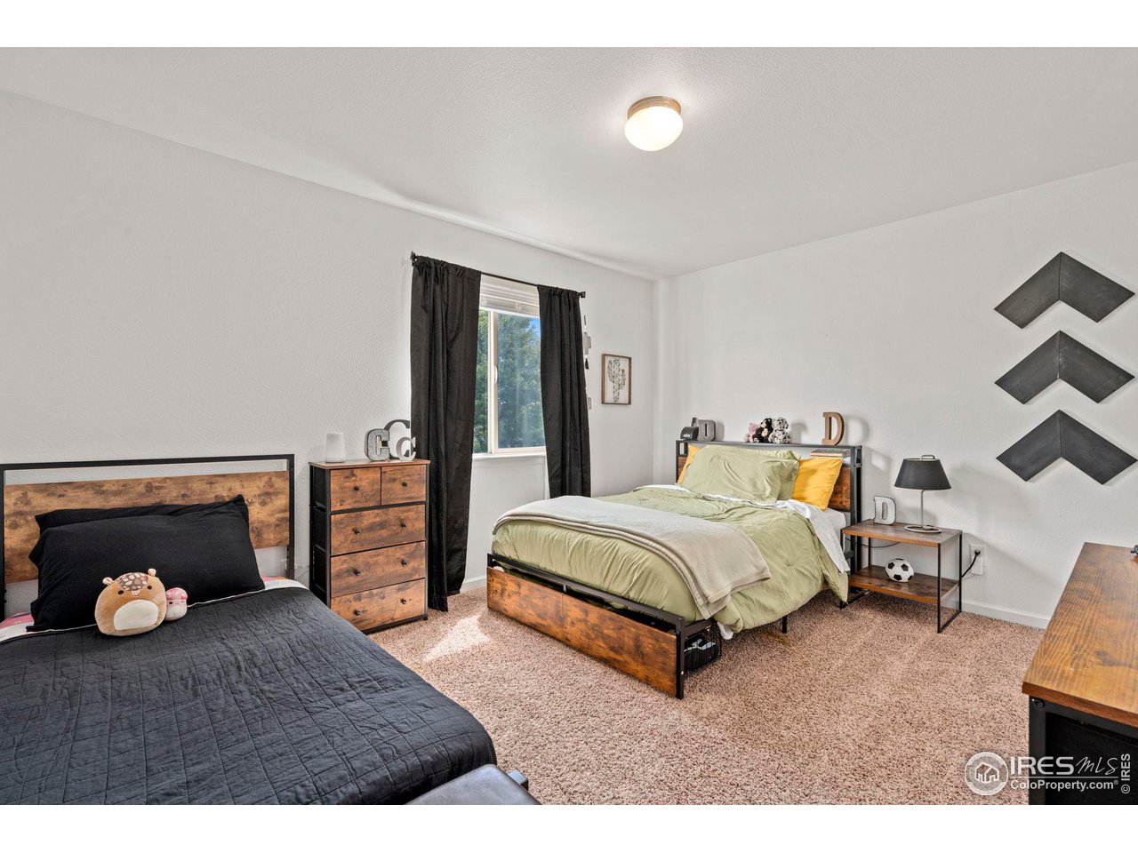 3224 Barbera Street Evans, CO 80634 - Photo 11 of 20 a spacious bedroom with a bed and window
