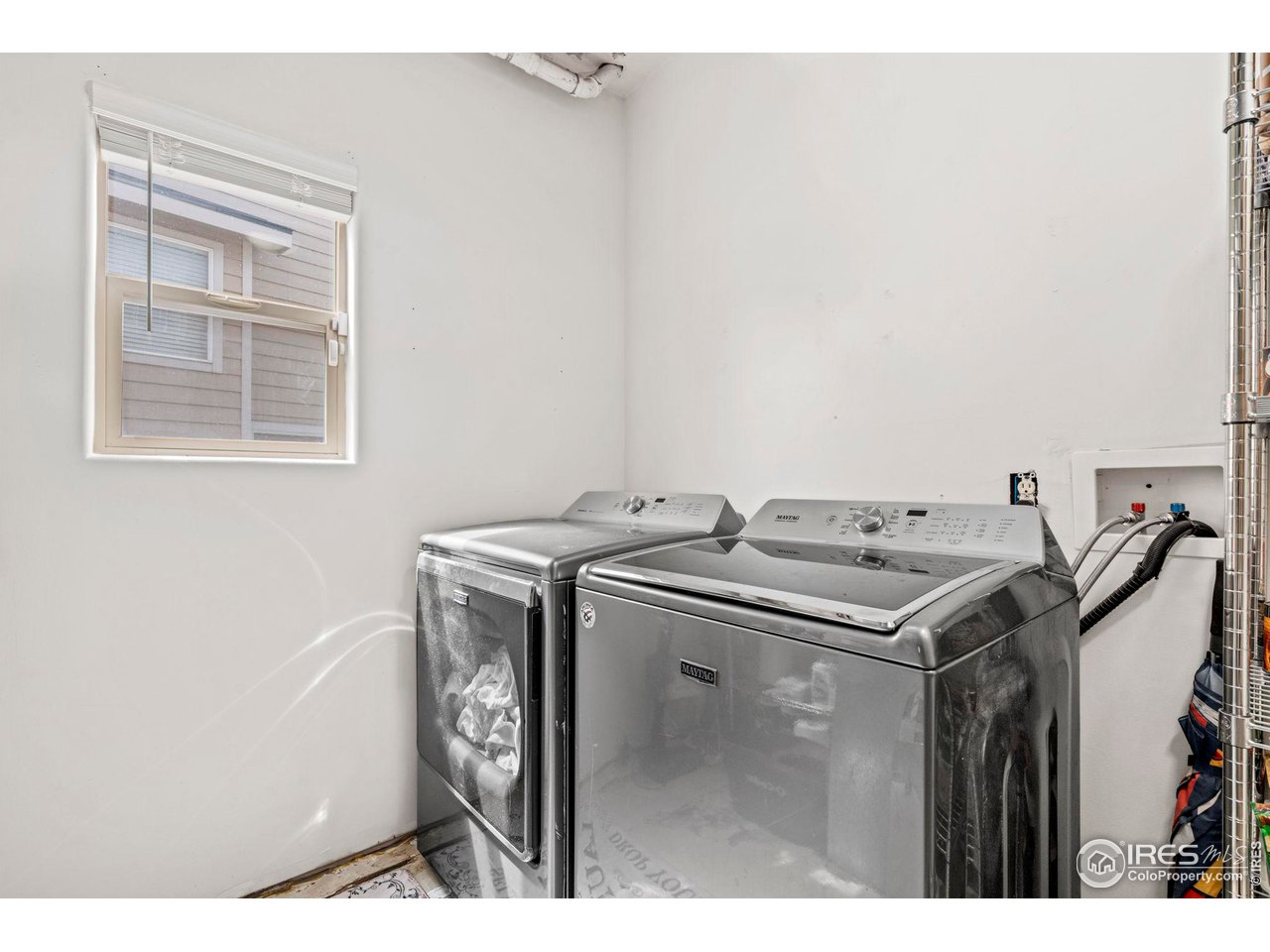 3224 Barbera Street Evans, CO 80634 - Photo 13 of 20 a utility room with dryer and washer