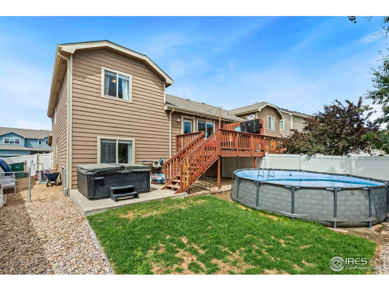 3224 Barbera Street Evans, CO 80634 - Photo 18 of 20 a view of a house with backyard sitting area and garden
