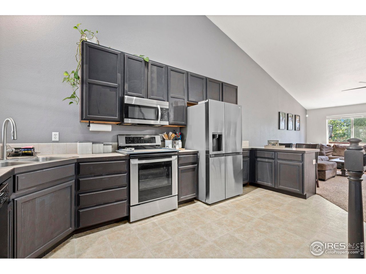 3224 Barbera Street Evans, CO 80634 - Photo 4 of 20 a kitchen with a refrigerator sink and stove