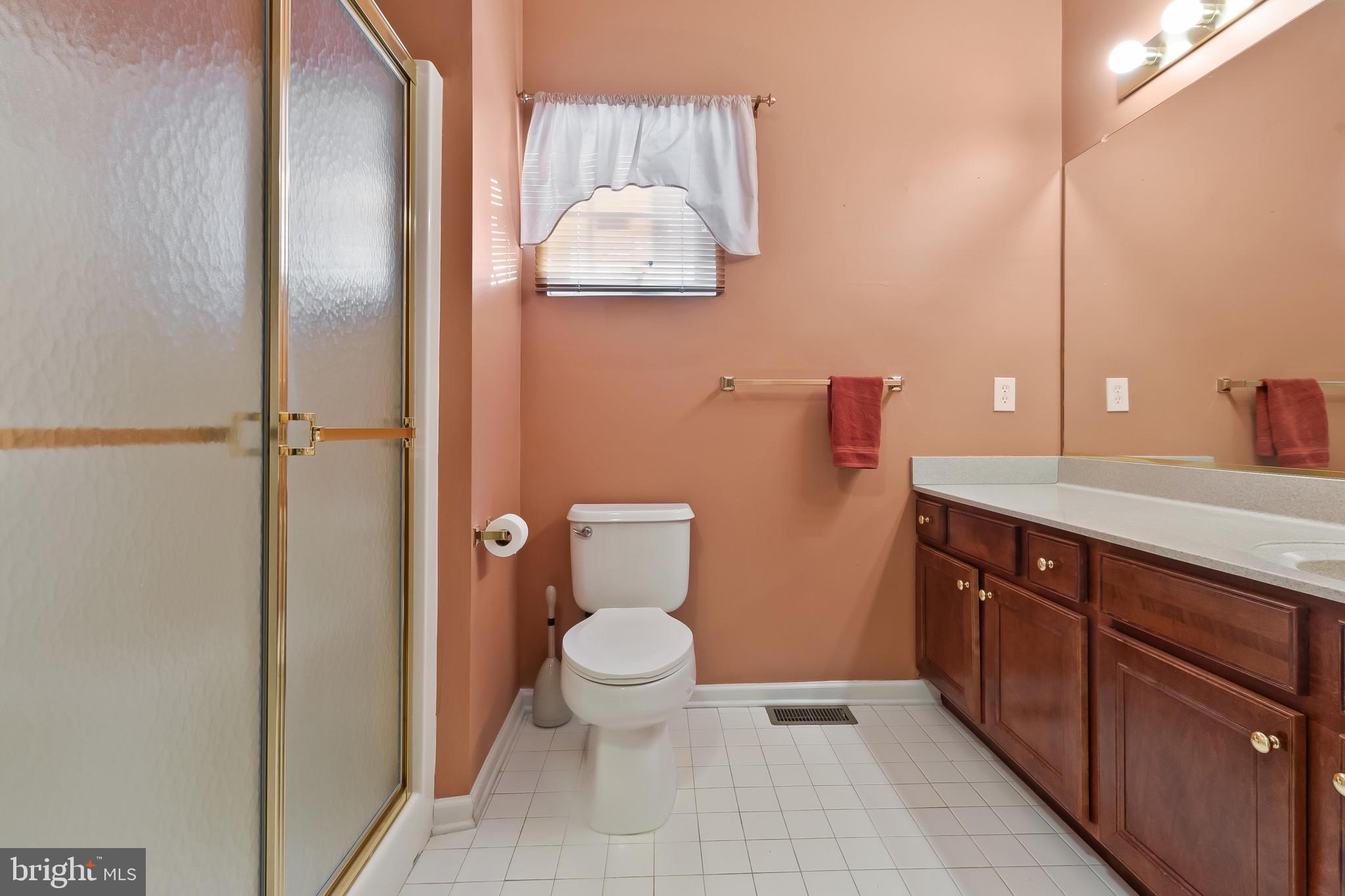1 Osmond Way Delanco, NJ 08075 - Photo 16 of 26 a bathroom with a sink a toilet and a mirror