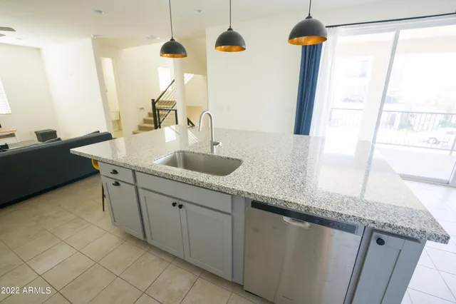 a kitchen with sink and window