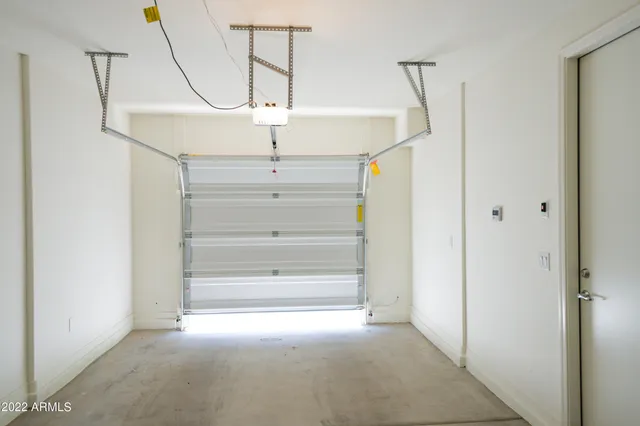 a view of a big room with closet and windows