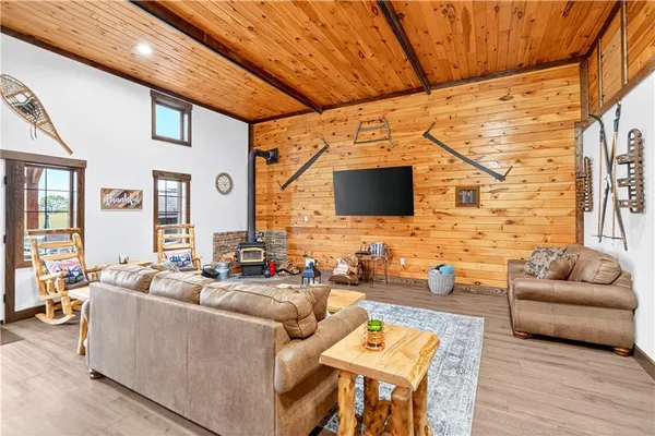 a living room with fireplace furniture and a flat screen tv