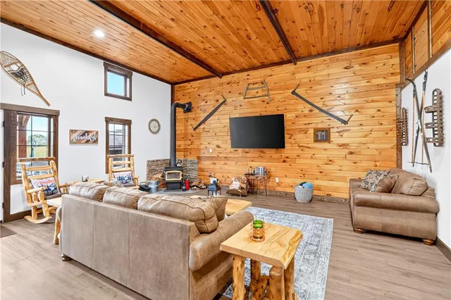 a living room with fireplace furniture and a flat screen tv