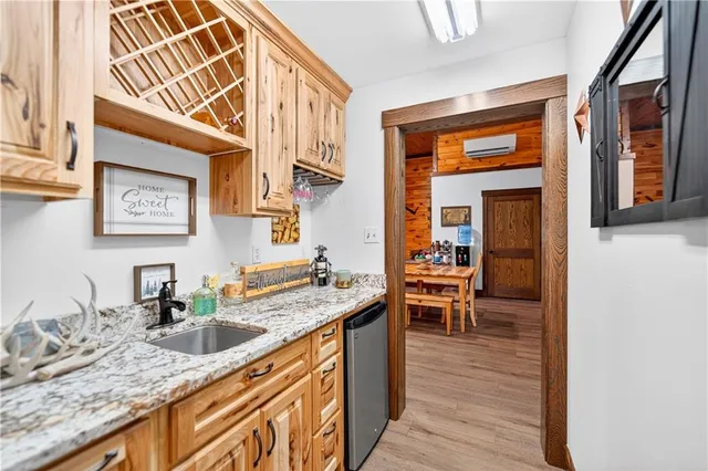 a kitchen with granite countertop sink stove and cabinets
