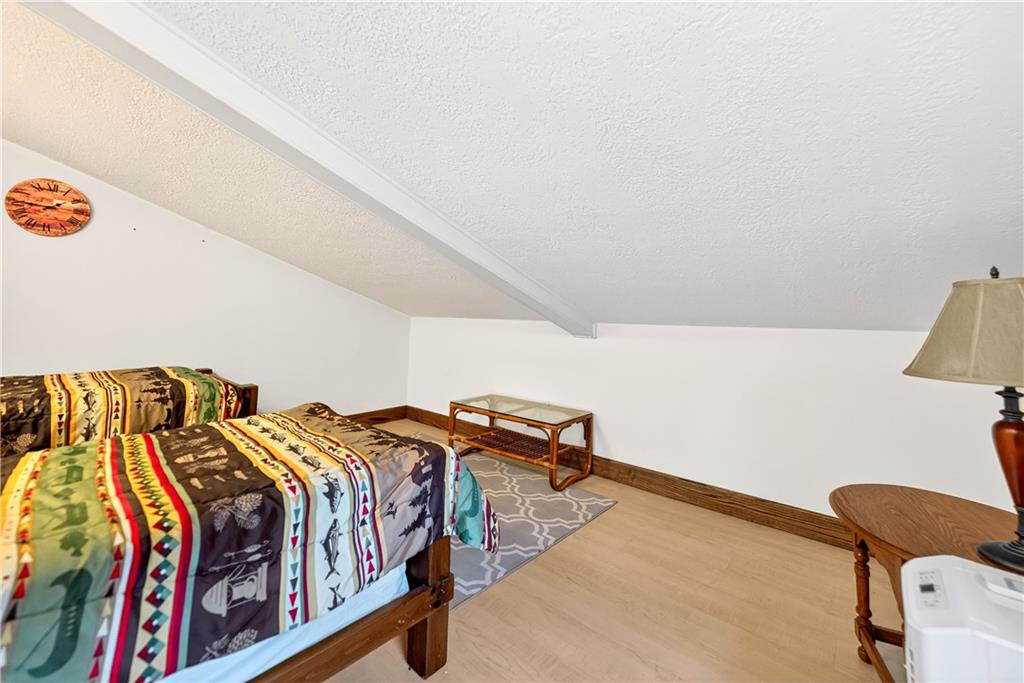 341 Skyview Road Stahlstown, PA 15687 - Photo 22 of 33 a bedroom with two beds and a couch