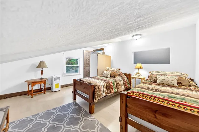 a bedroom with furniture and a window