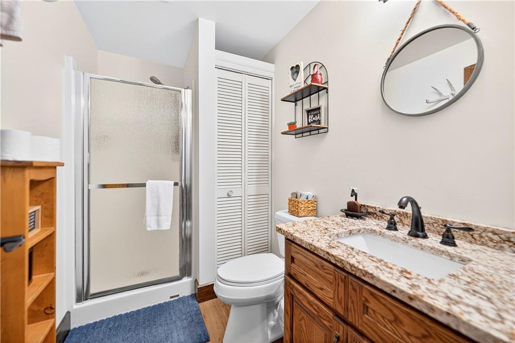 341 Skyview Road Stahlstown, PA 15687 - Photo 25 of 33 a bathroom with a granite countertop sink toilet and a mirror