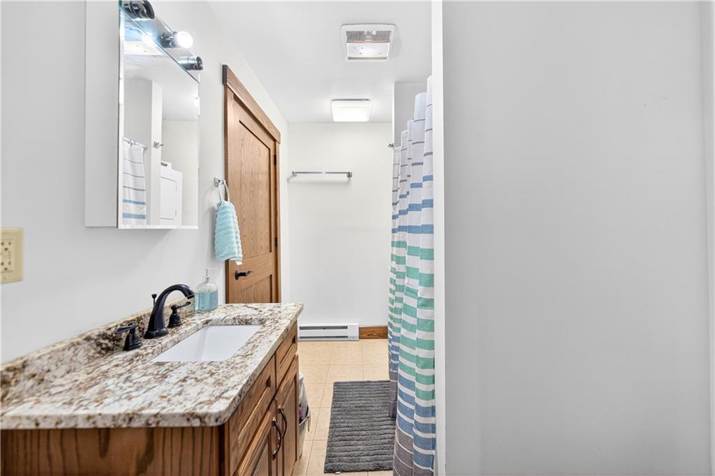 341 Skyview Road Stahlstown, PA 15687 - Photo 26 of 33 a bathroom with a granite countertop sink and a mirror