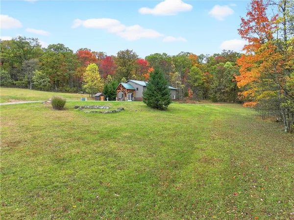 a view of a field with an trees