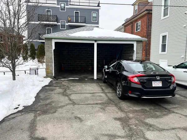 a car parked in front of a house