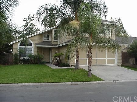 28641 Newcastle Road Highland, CA 92346 - Photo 1 of 1 a front view of a house with a yard and garage