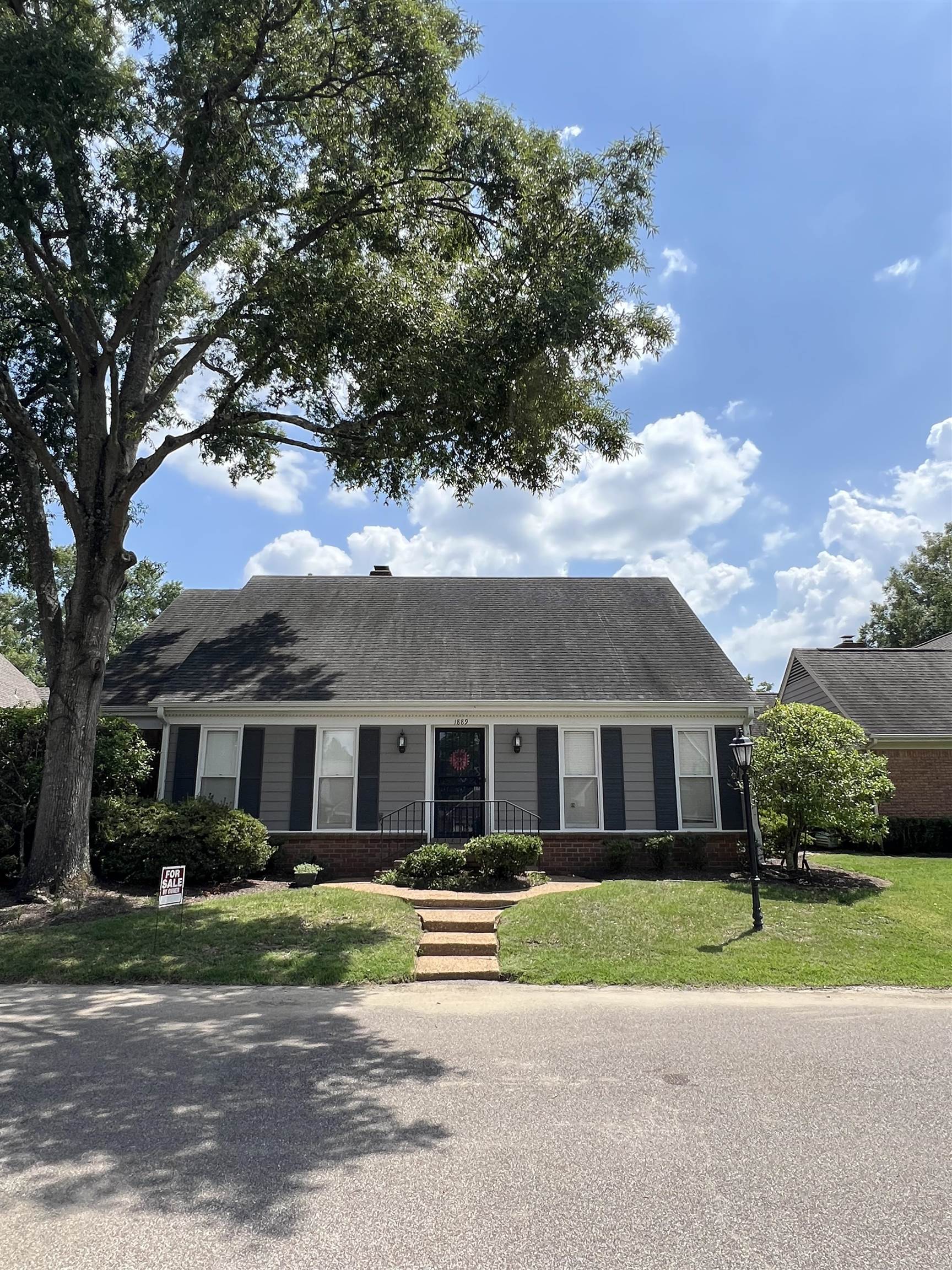 1889 Allenby Road Germantown, TN 38139 - Photo 2 of 17 front view of house with a yard