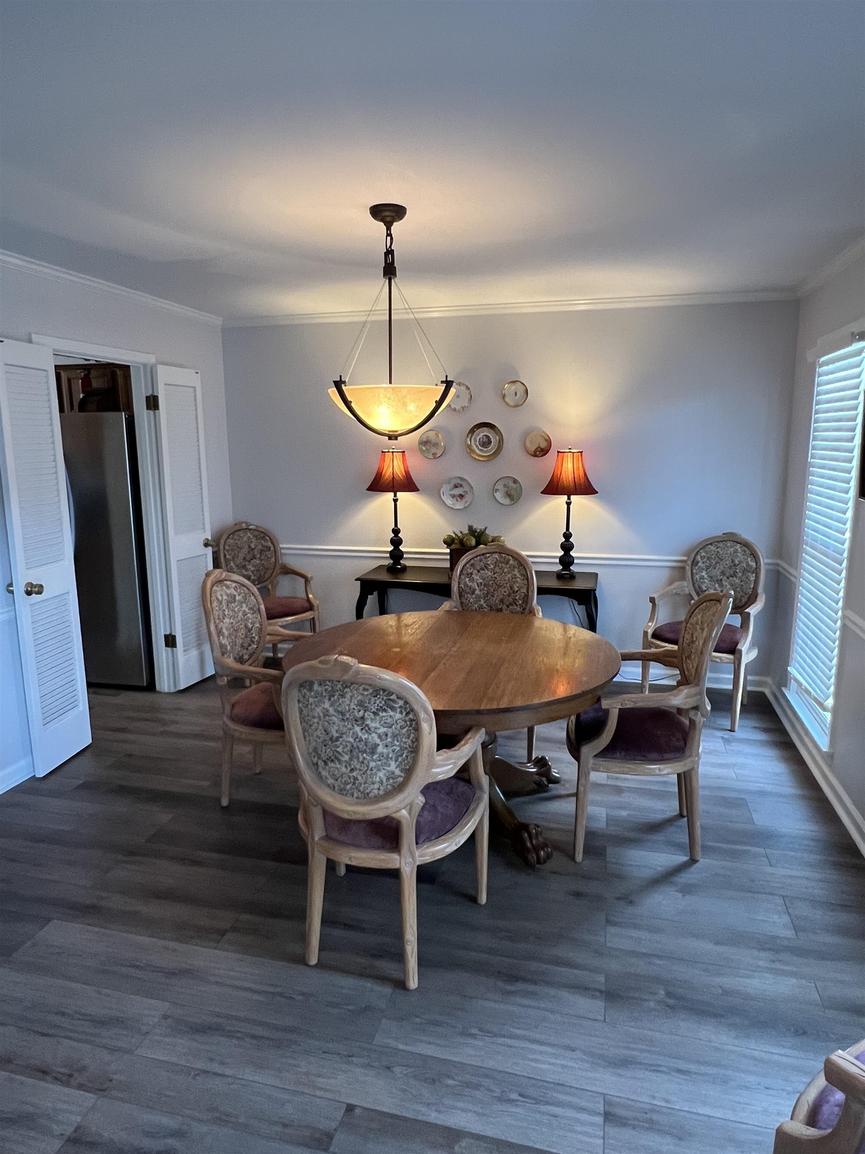 1889 Allenby Road Germantown, TN 38139 - Photo 8 of 17 a view of a dining room with furniture and wooden floor