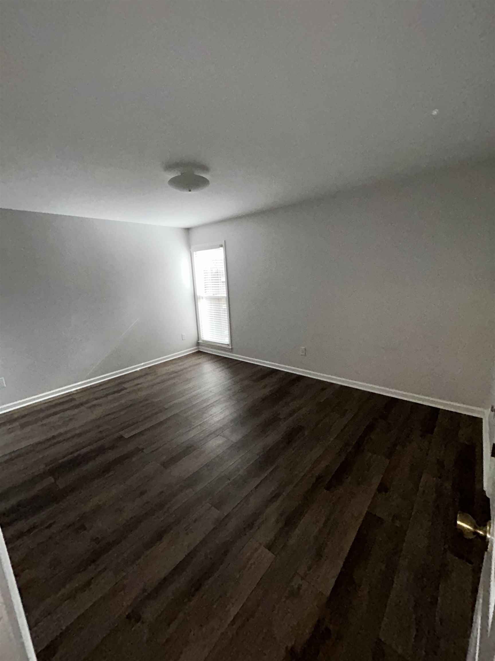 1889 Allenby Road Germantown, TN 38139 - Photo 9 of 17 a view of an empty room and wooden floor