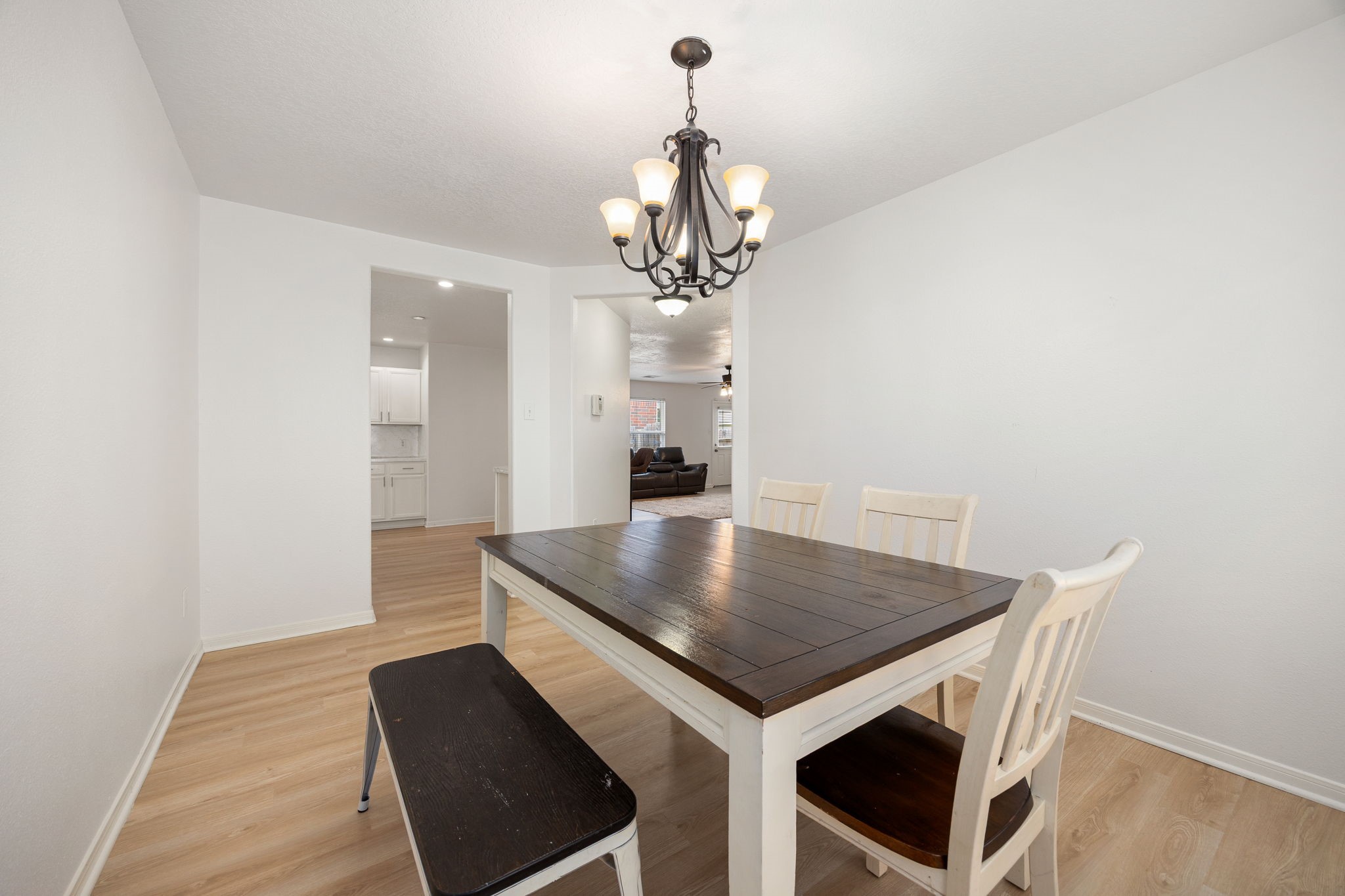 5038 Natchez Ridge Court Katy, TX 77449 - Photo 13 of 26 a view of a dining room with furniture and wooden floor