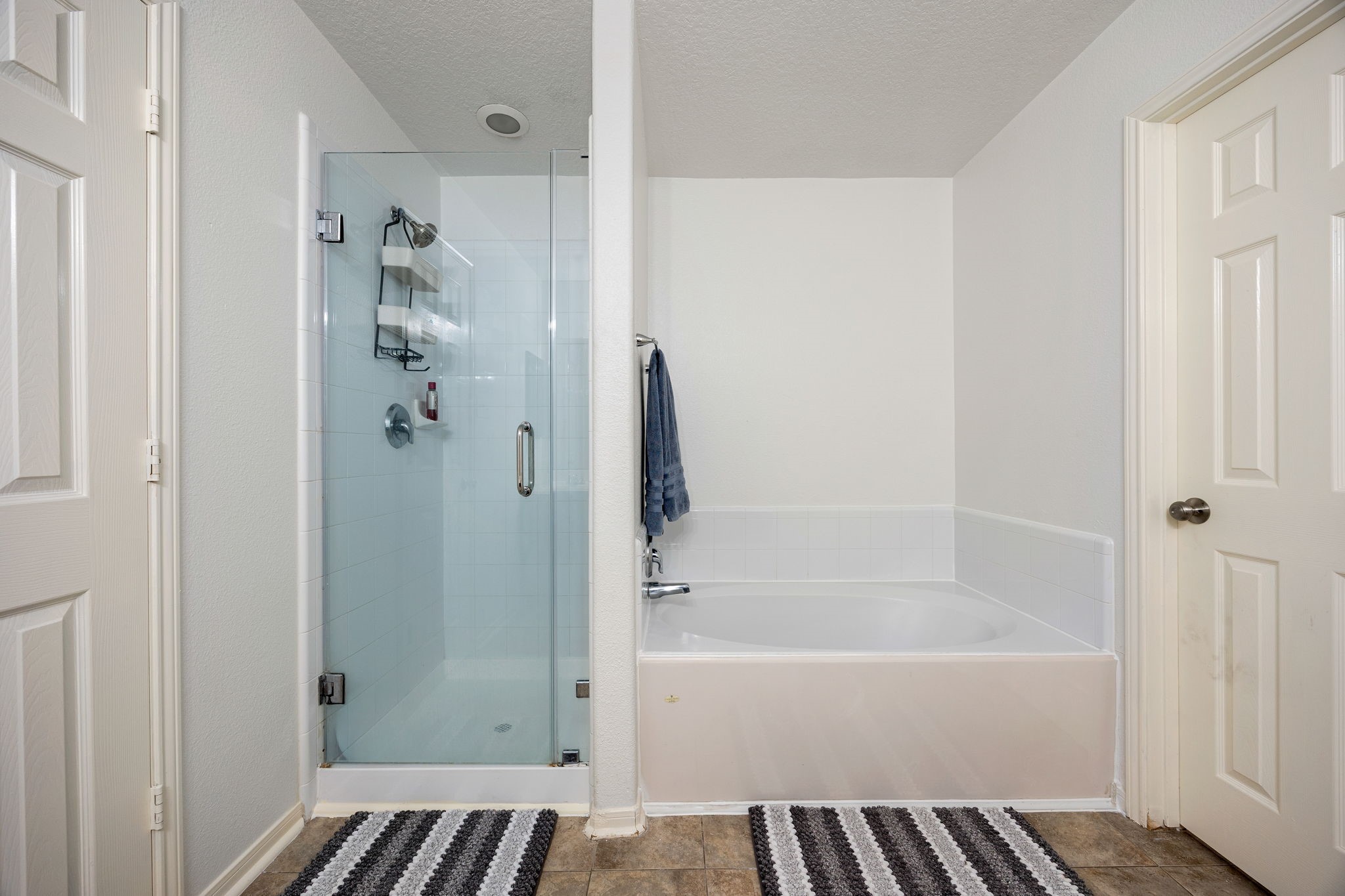 5038 Natchez Ridge Court Katy, TX 77449 - Photo 16 of 26 a bathroom with a bathtub and a shower
