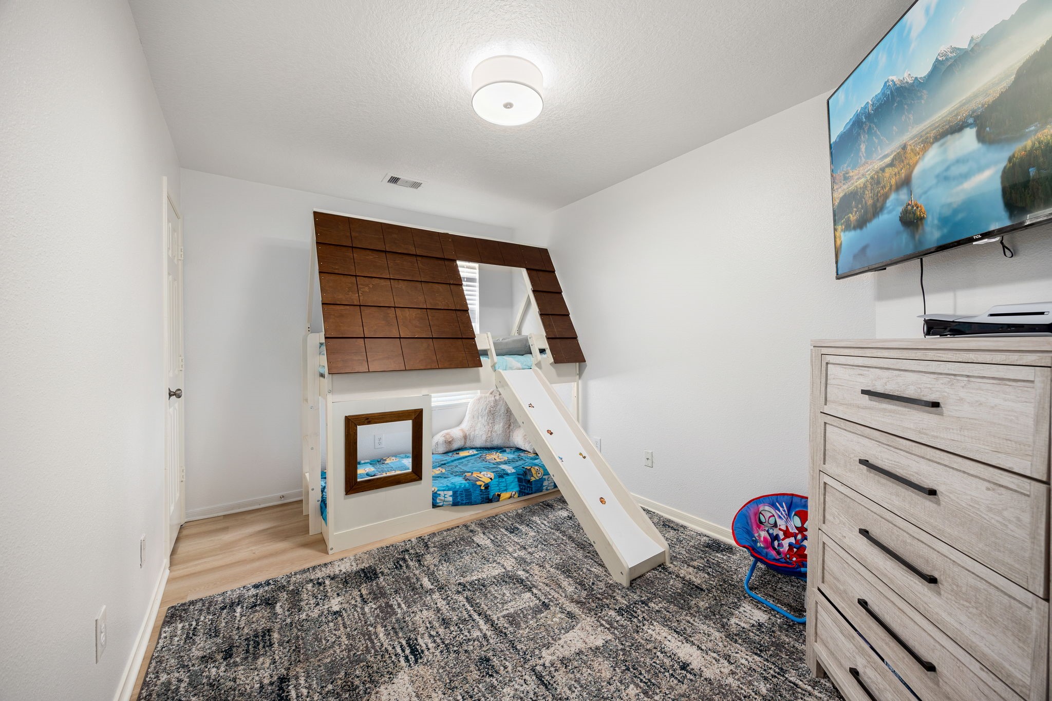 5038 Natchez Ridge Court Katy, TX 77449 - Photo 19 of 26 a bedroom with a bed and wooden floor