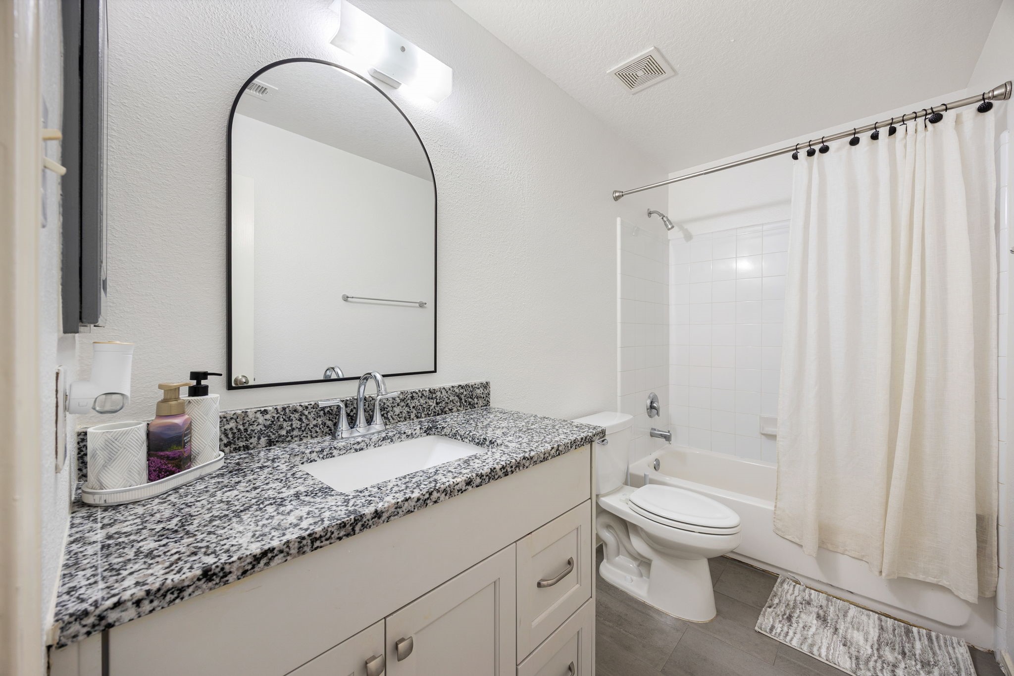 5038 Natchez Ridge Court Katy, TX 77449 - Photo 20 of 26 a bathroom with a granite countertop sink toilet and shower